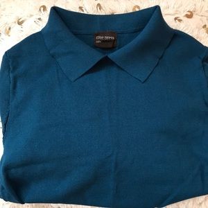 Teal short sleeved shirt.